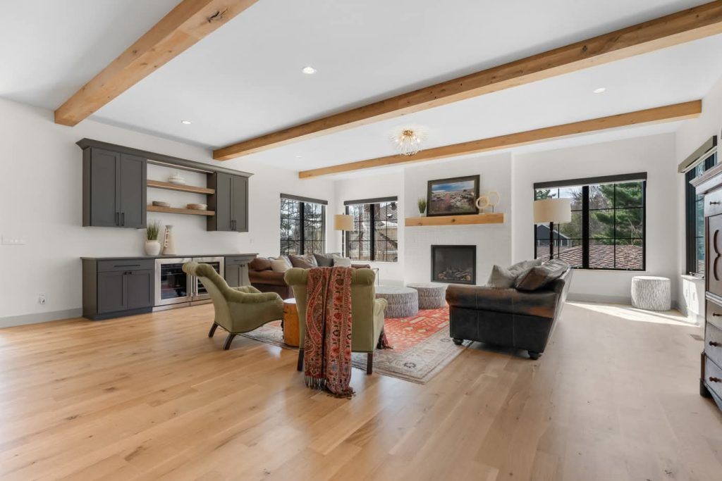 Modern living room with fireplace and wooden beams