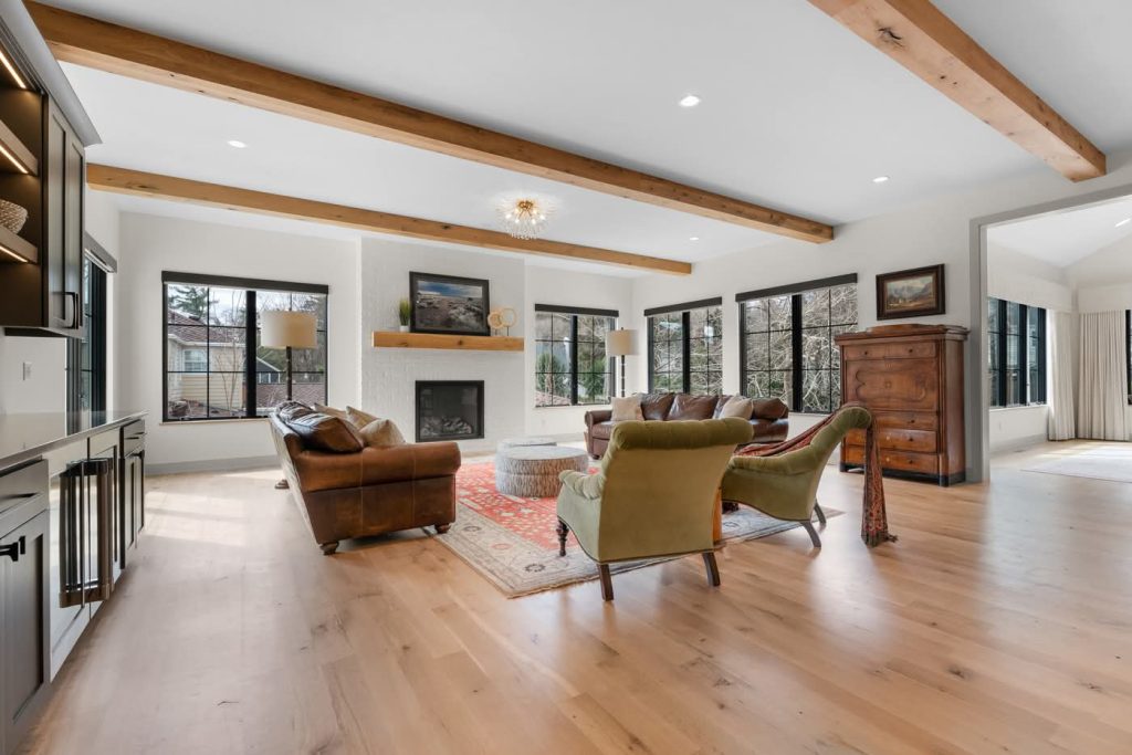 Spacious living room with hardwood floors and fireplace