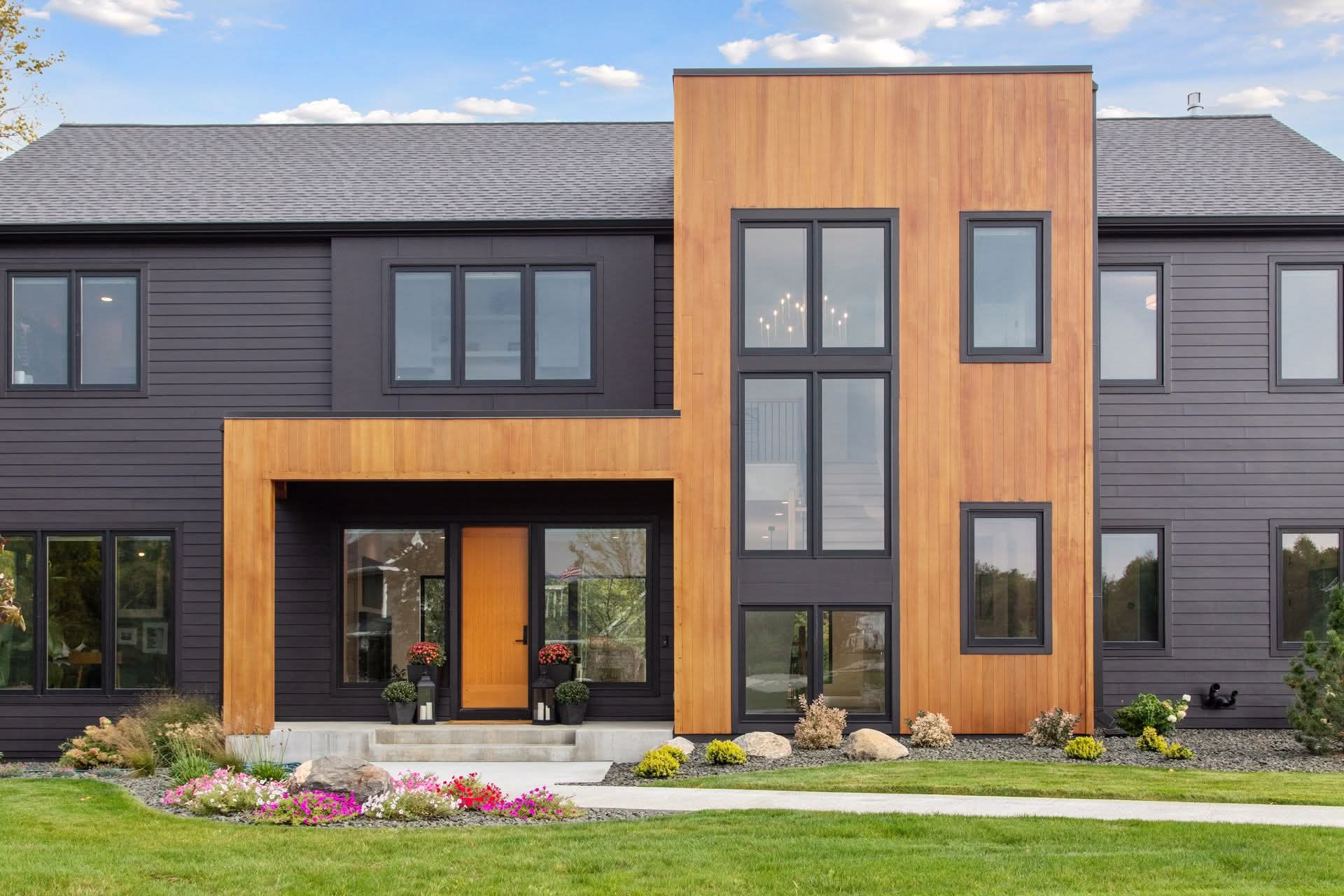 Modern house exterior with wood and dark siding