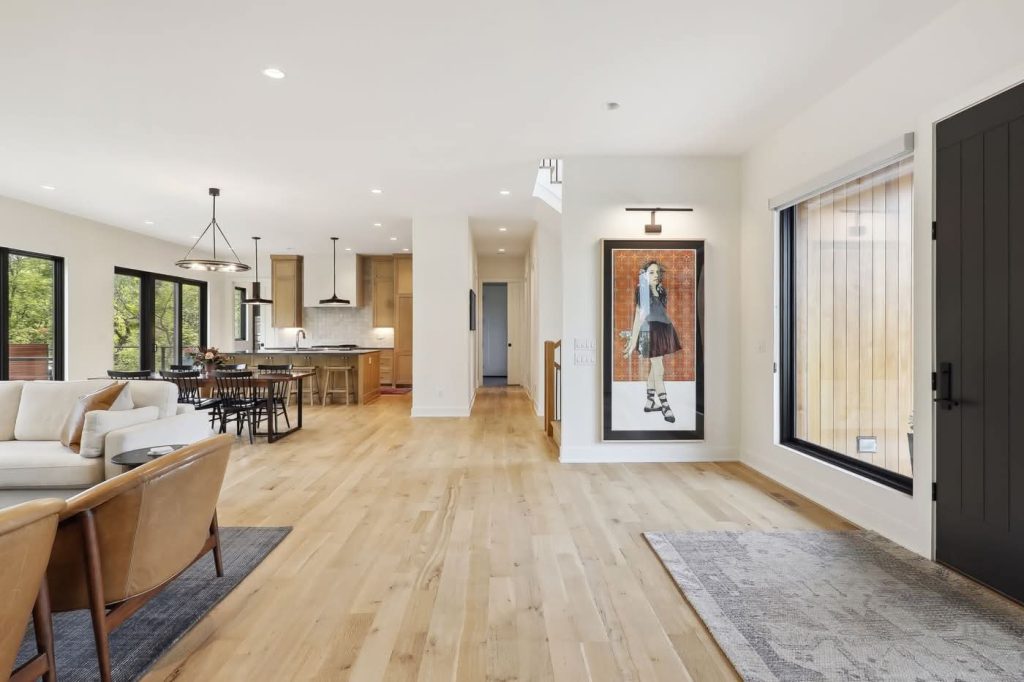 Modern open-concept living room and kitchen with wood floors