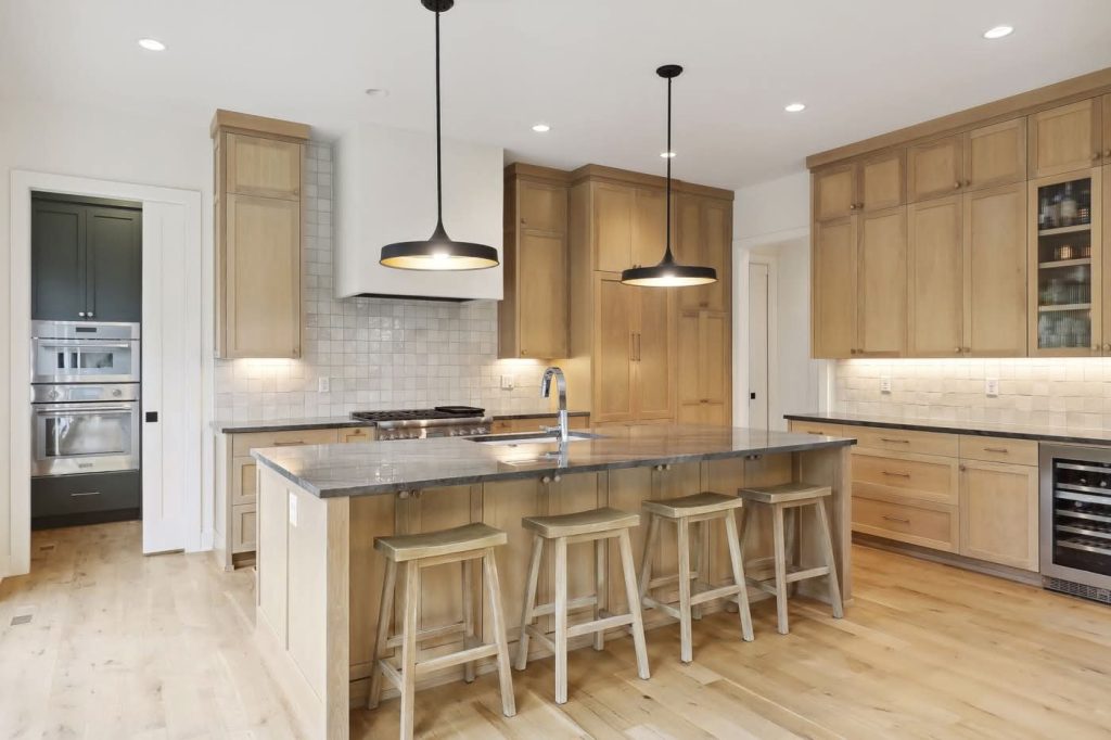 Modern kitchen with wooden cabinets and large island