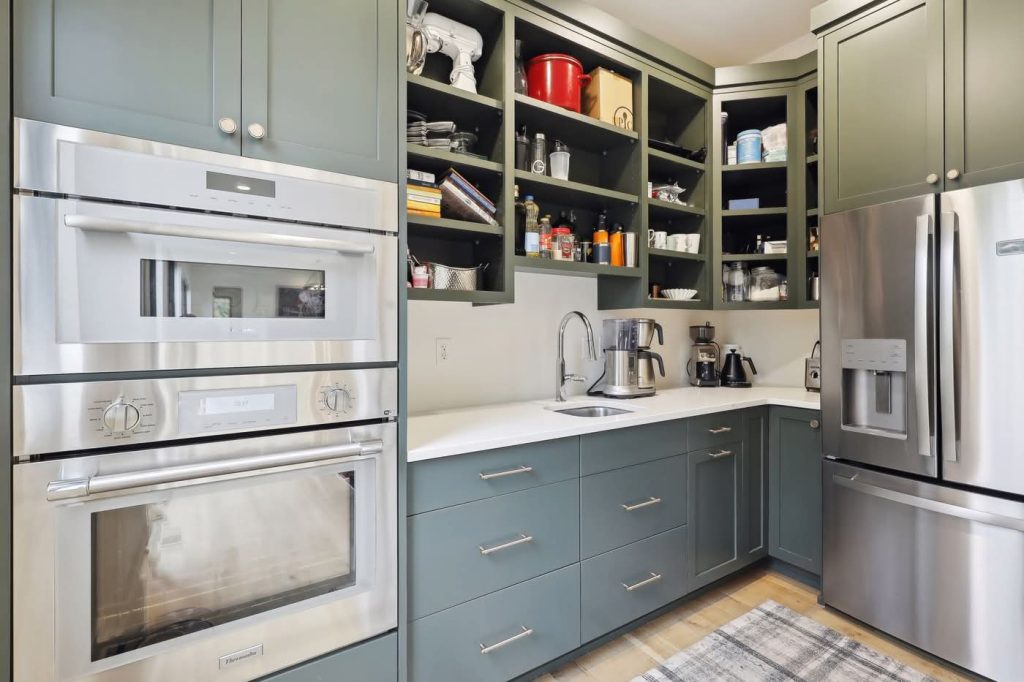 Modern kitchen pantry with open shelves and appliances