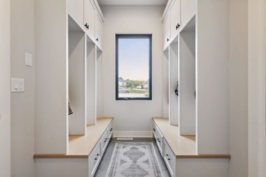 Modern mudroom with built-in benches and window