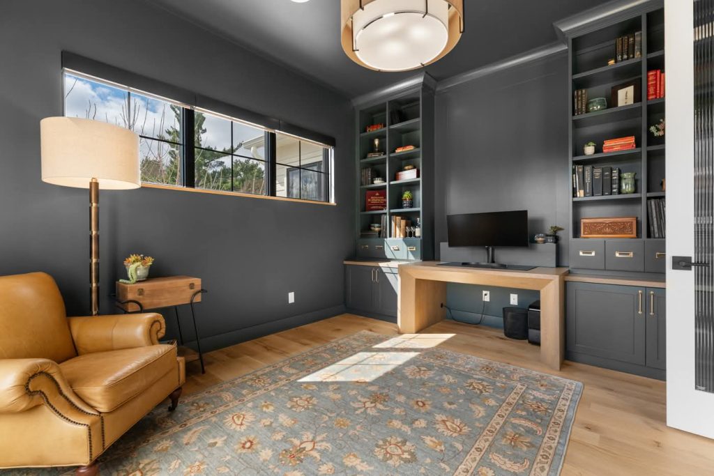 Modern home office with built-in shelves and desk