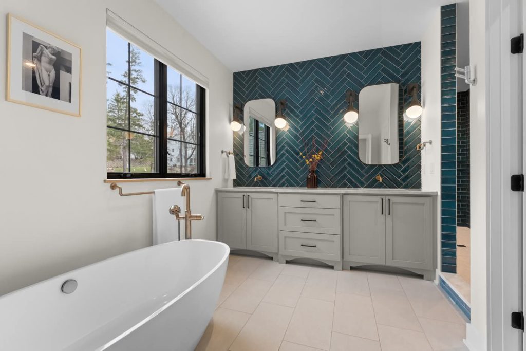 Modern bathroom with freestanding tub and teal tile