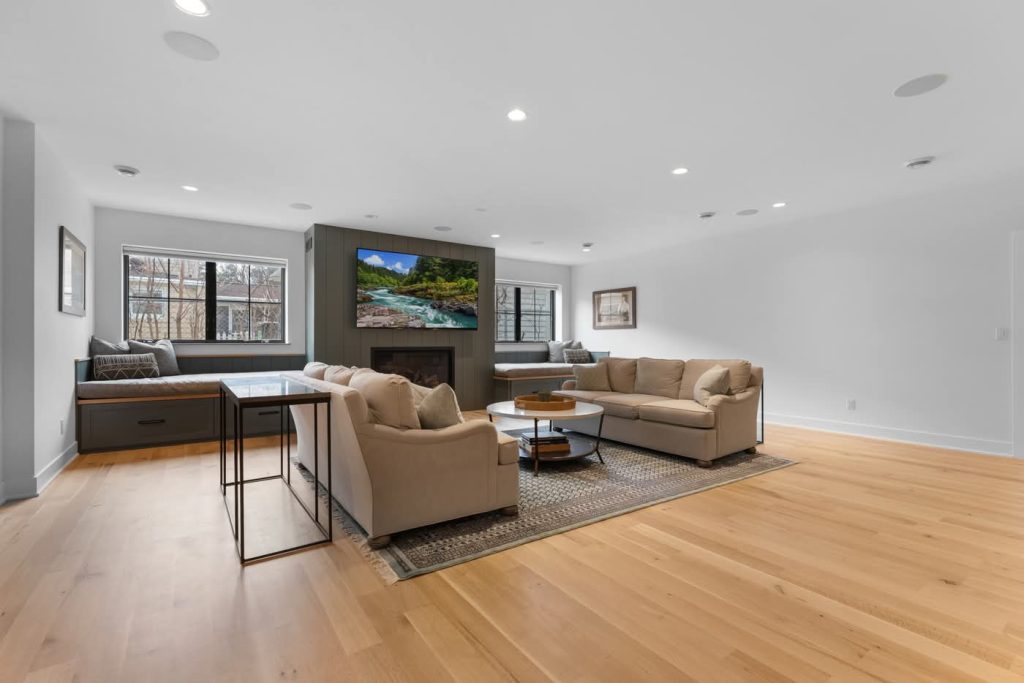 Modern living room with fireplace and beige sofas