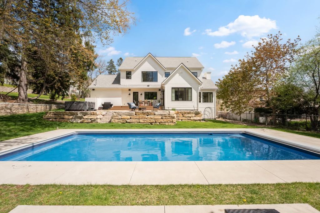 Modern white house with backyard swimming pool