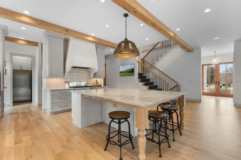 Modern farmhouse kitchen with large island and beams