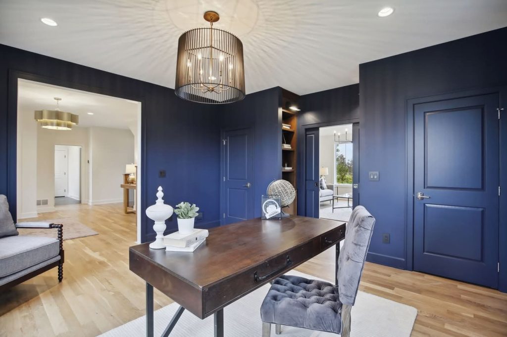 Modern navy home office with wooden desk
