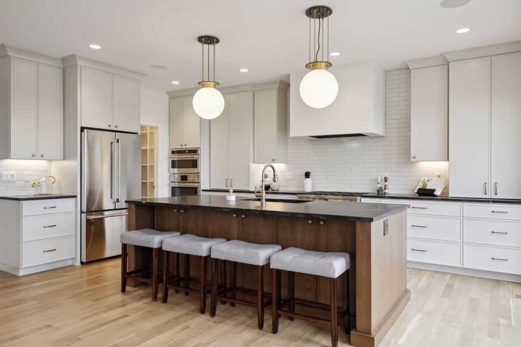 Modern white kitchen with island and pendant lights