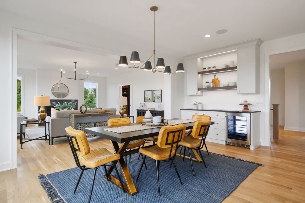 Modern dining room with wooden table and yellow chairs