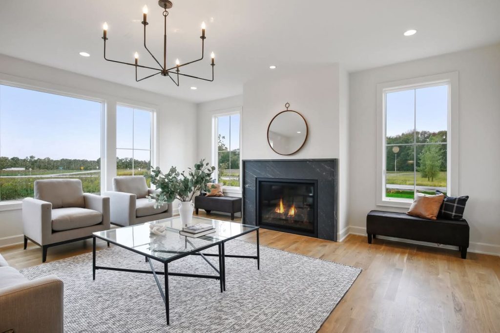 Modern living room with fireplace and large windows