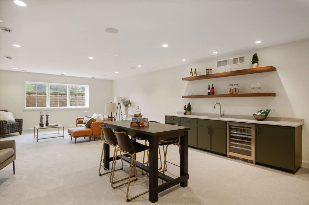 Modern basement with wet bar and seating area