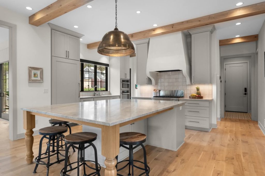 Modern farmhouse kitchen with island and wooden beams