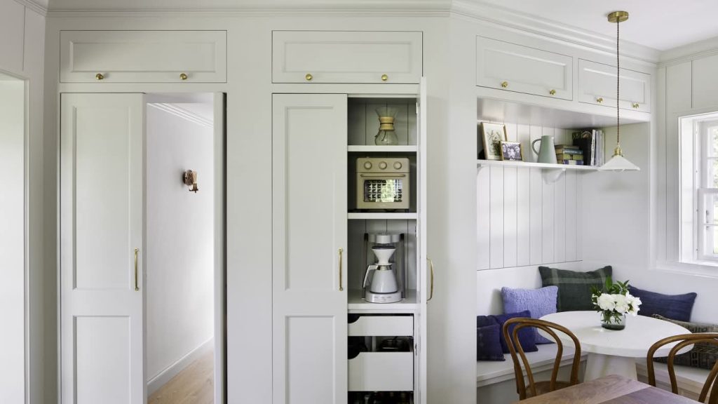 Built-in kitchen cabinets with hidden coffee station