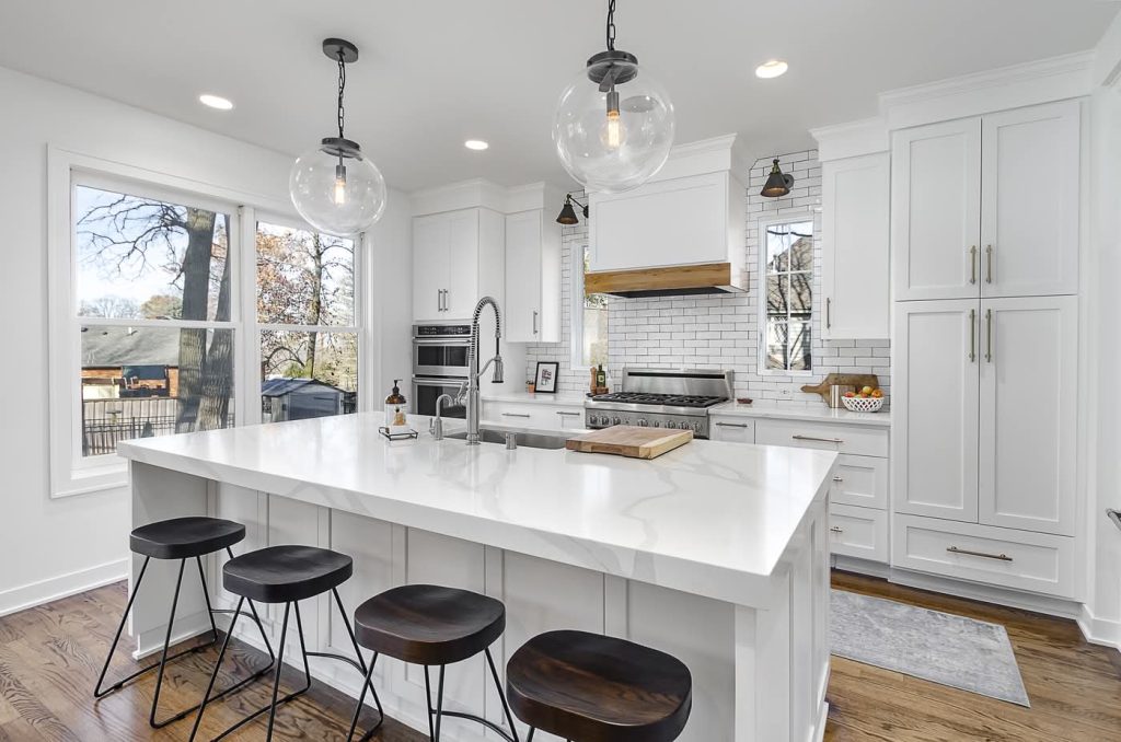 Bright modern white kitchen with large island