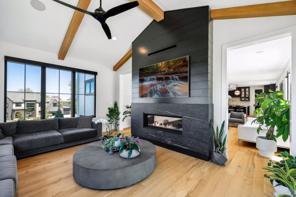 Modern living room with fireplace and large windows
