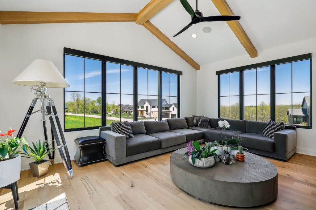 Modern living room with large windows and sectional sofa