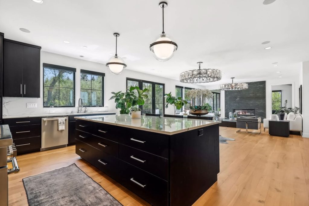 Modern open-concept kitchen with large island and fireplace