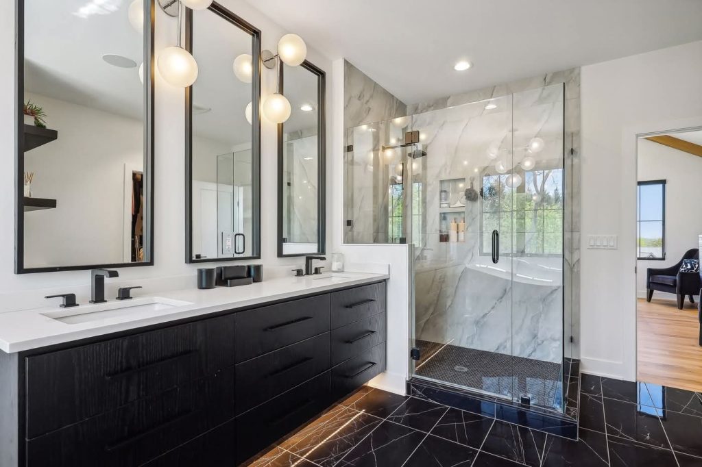 Modern bathroom with double vanity and glass shower