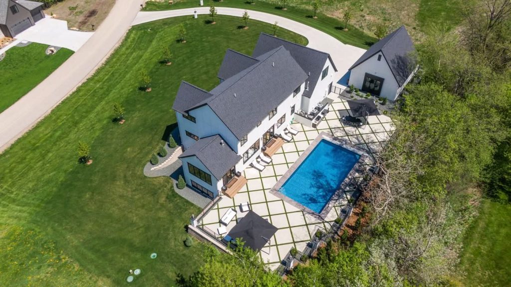 Aerial view of modern home with pool