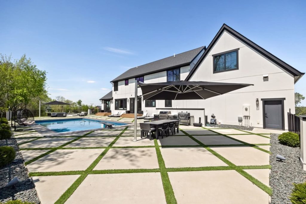 Modern home backyard with pool and patio
